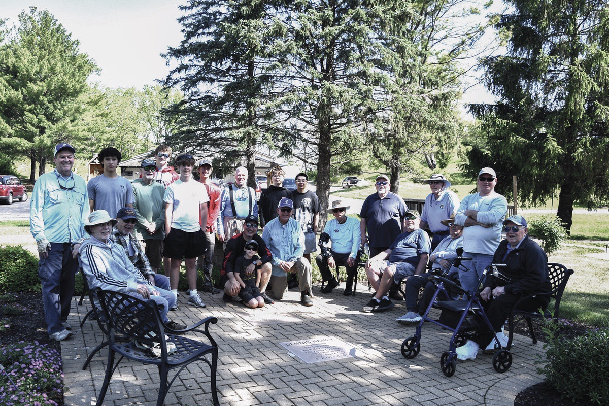 Sun City Angler Charter Club members pause for a photo while fishing with Huntley High School Bass Fishing Club members. (Photo by Christine Such/My Sun Day News)