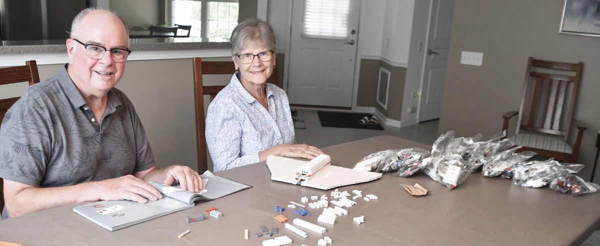 Robert Supernaw and wife, Arlene, sort LEGO pieces for Supernaw’s next build. (Photo by Christine Such/My Sun Day News)